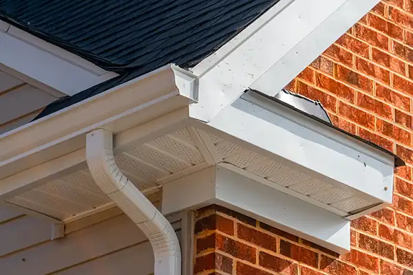 White, k-style gutter system attached to a home