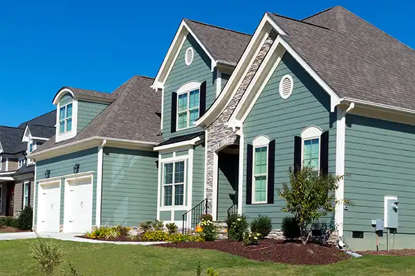 Mid-class home with green siding